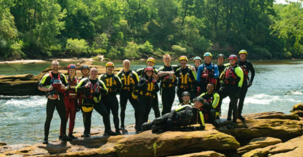 Group of fire personnel along the Chattahoochee River