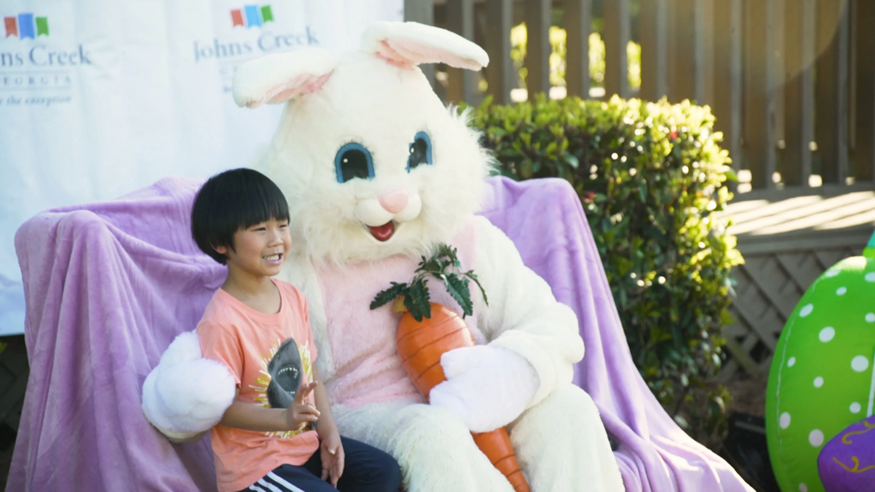 Child sitting with Easter Bunny