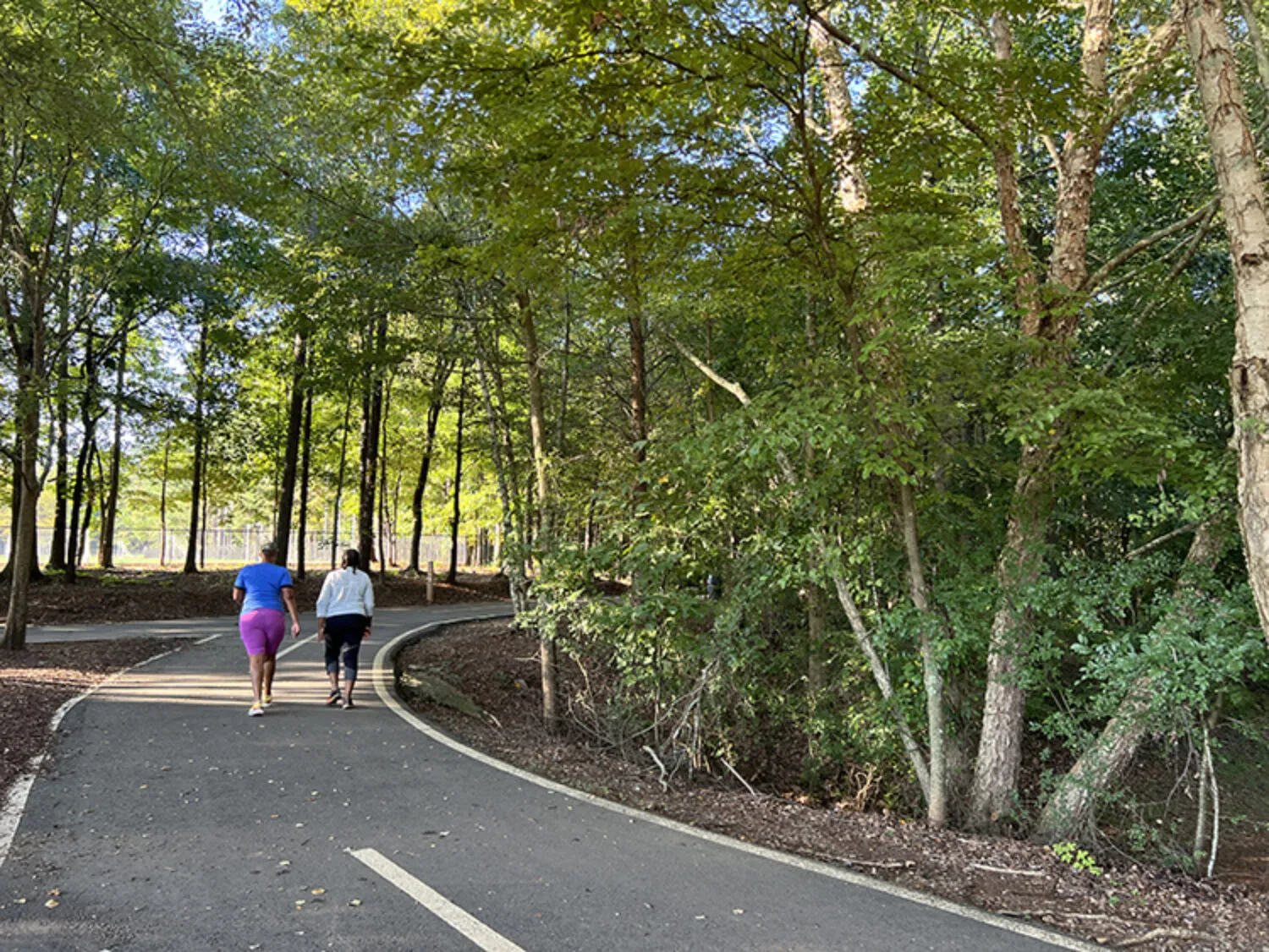 Two women walking on the Newtown Park trail